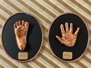 SET OF PERSONALIZED BRONZED HANDPRINT AND FOOTPRINT ON BLACK OVAL FOR BABIES