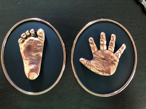 SET OF PERSONALIZED BRONZED HANDPRINT AND FOOTPRINT ON BLACK OVAL FOR BABIES